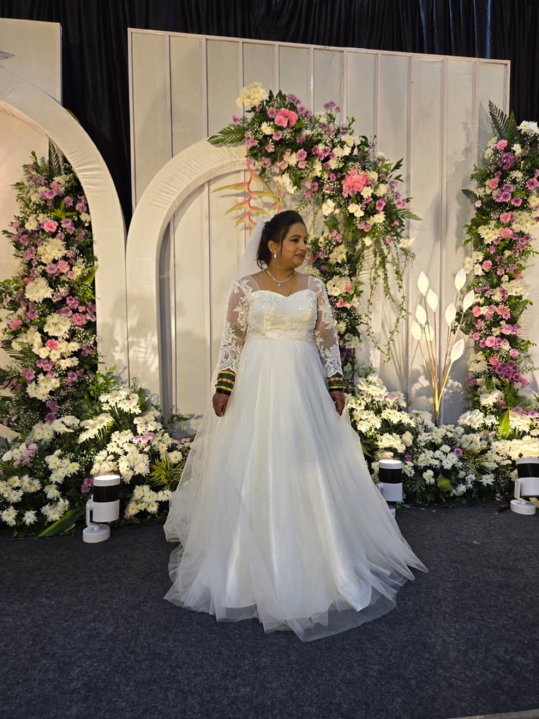 Bride at the floral arch